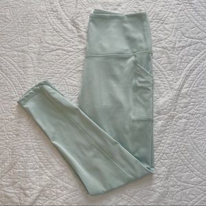 Pastel mint high waisted leggings with pockets and criss cross detail